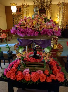 During the service parishioners use ladle to pour sweet tea over the statue and bathe the baby Sakyamuni.