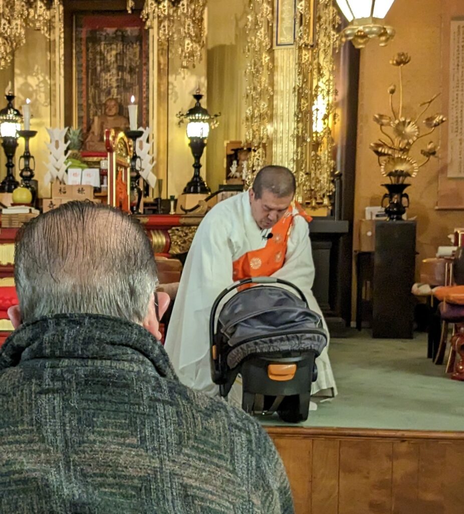 Rev. Igarashi blesses Edwin Lou Woodford Hughes during Setsubun service